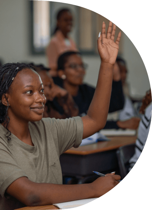 A student raising their hand in class
